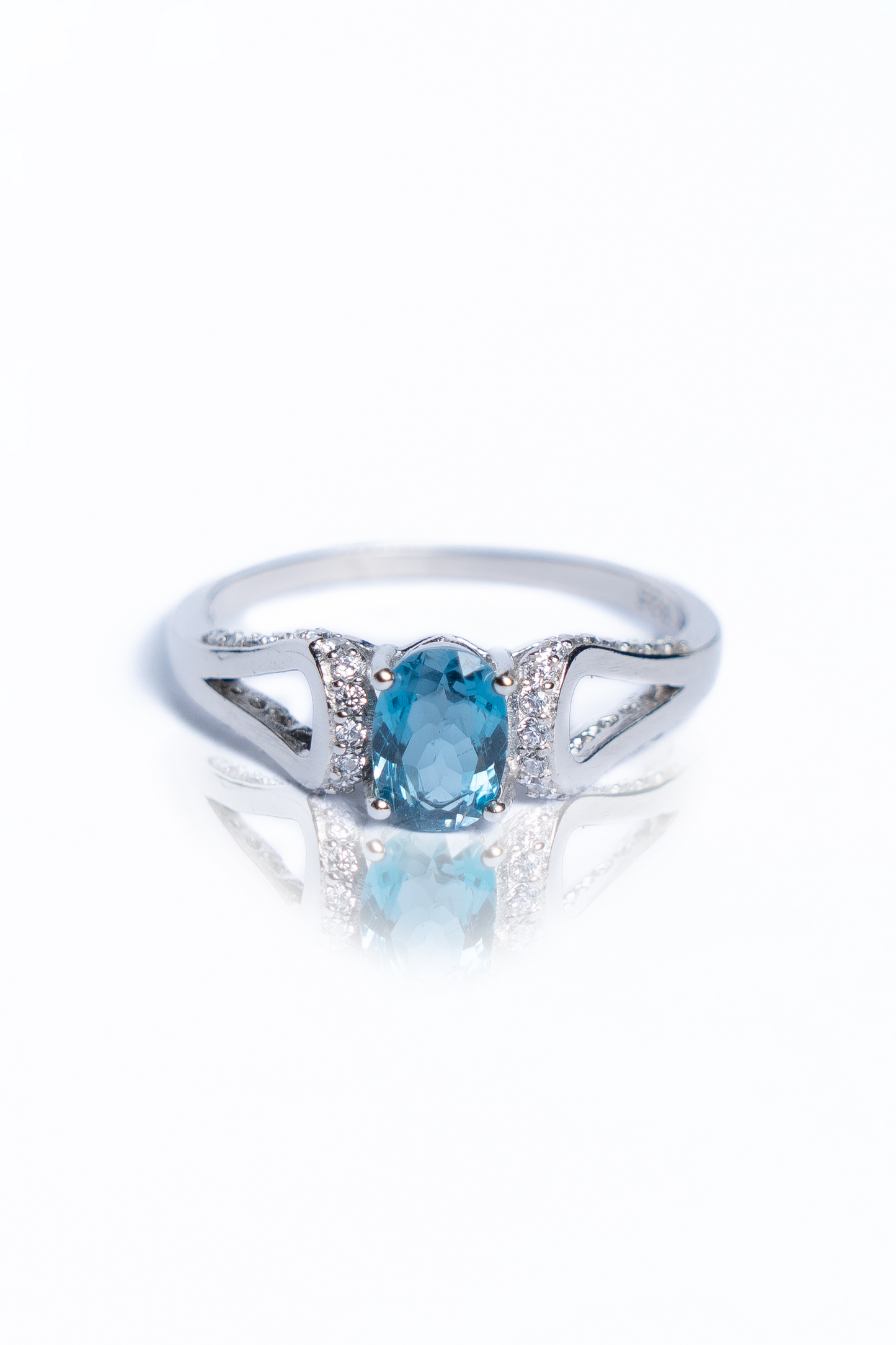 Blue Topaz And Zircon Curve Ring